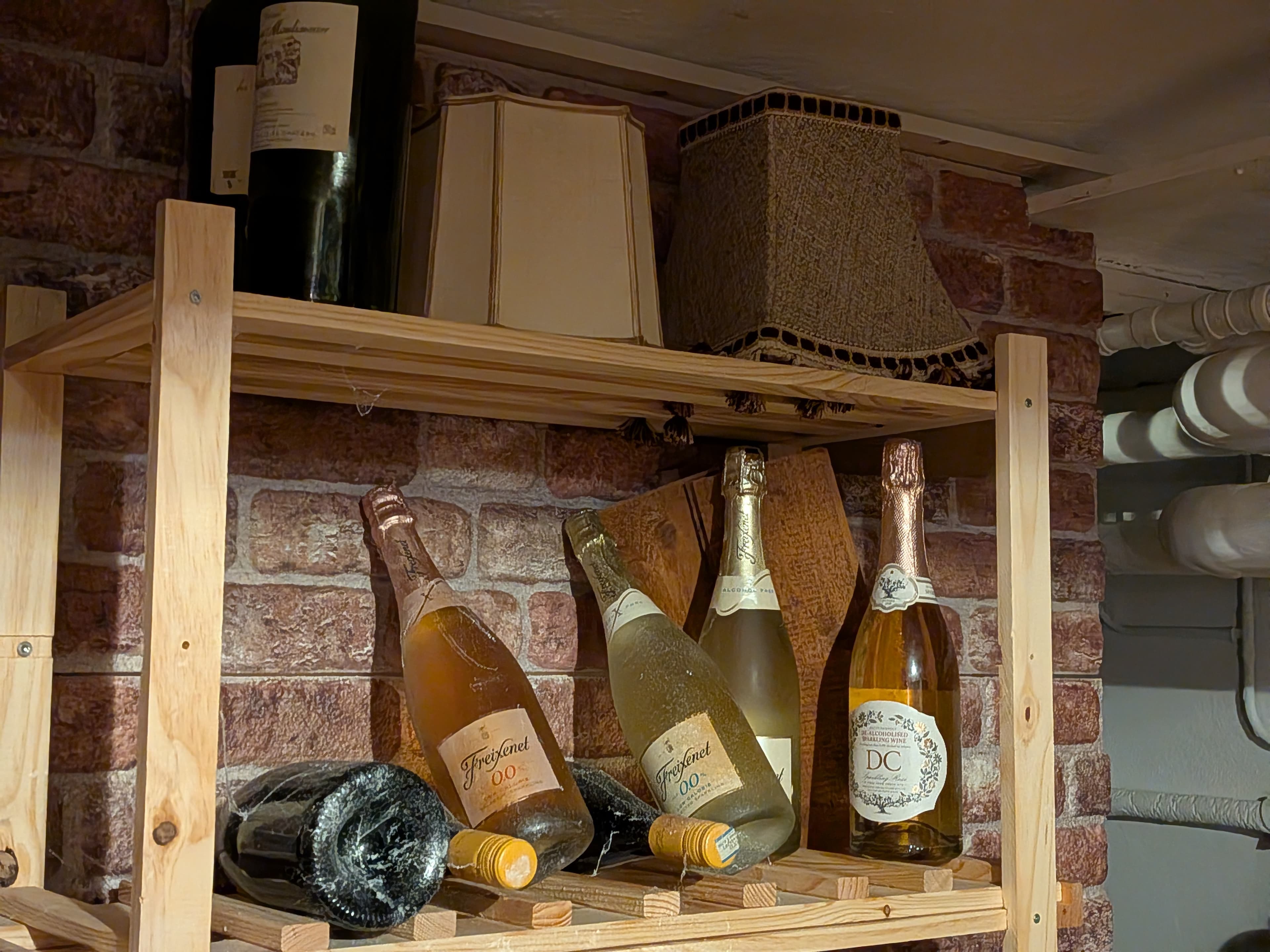 3. Creating fake dust and spider webs on the wine bottles.